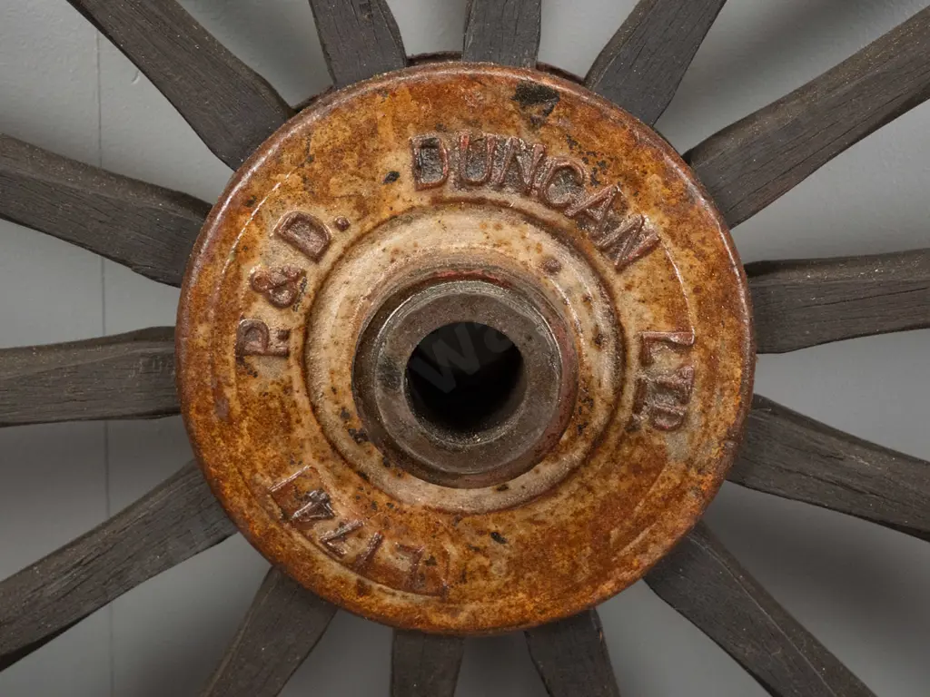 large timber and metal cart wheel with cast iron hub stamped P & D Duncan (Christchurch) D-1230 Image 1++