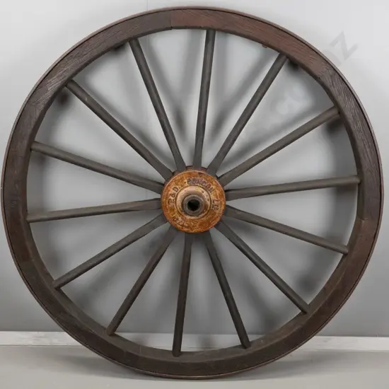 large timber and metal cart wheel with cast iron hub stamped P & D Duncan (Christchurch) D-1230