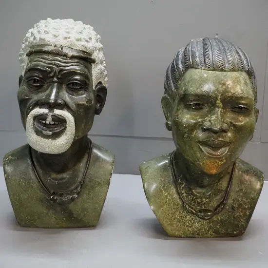 pair of carved stone busts - Nelson & Winnie Mandela, signed Farai Gatsi. Chips & scrapes, esp.to face of Nelson H-440