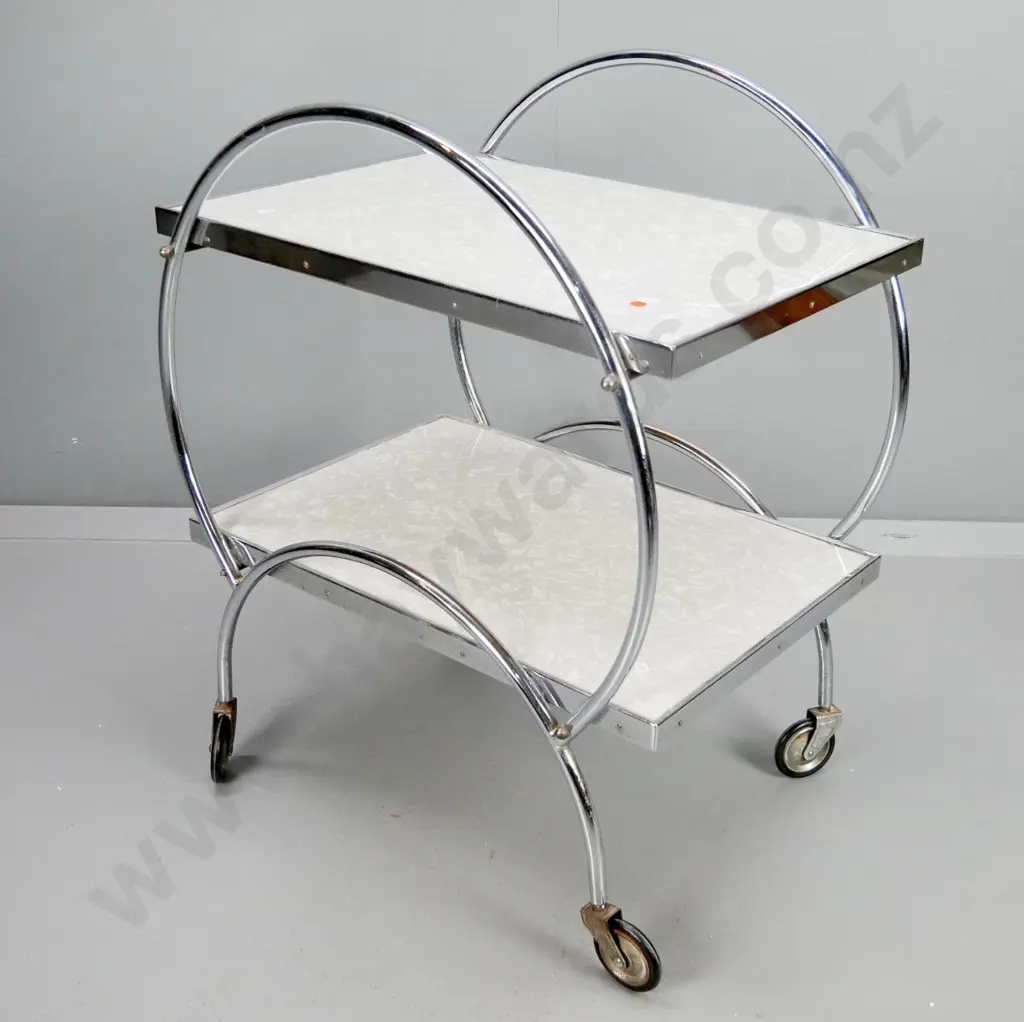 retro 2-tier formica and chrome hoop side tea trolley with metal & rubber wheels, minor pitting in spots Image 1++