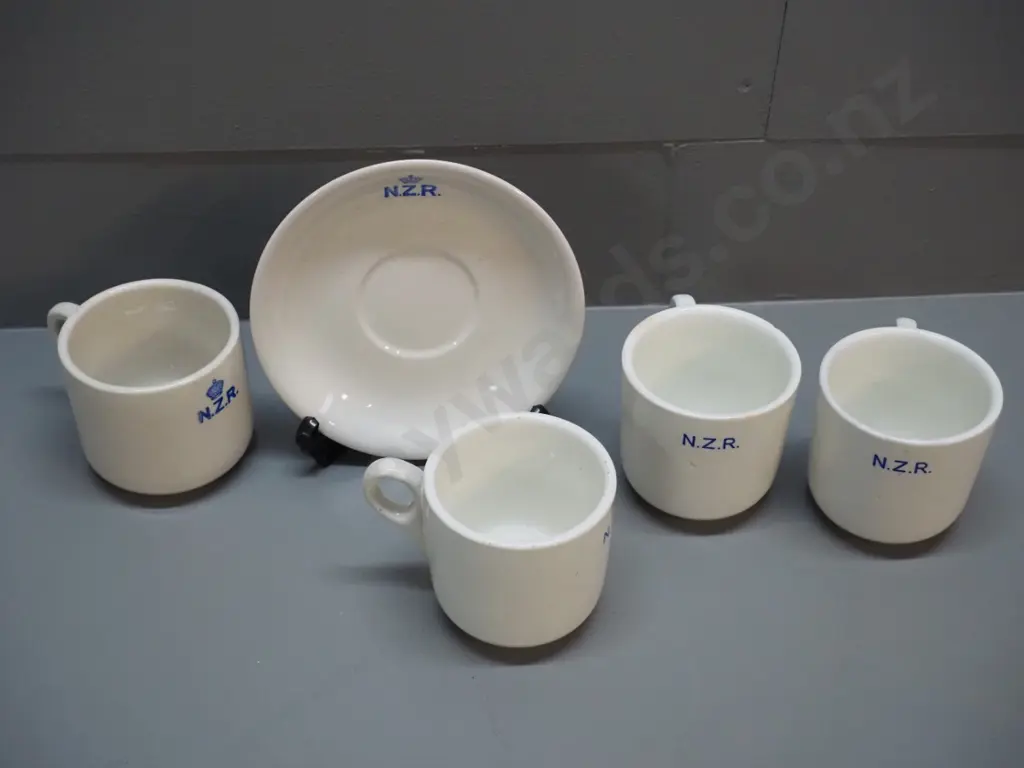 Crown Lynn NZR cup & saucer in good condition & 3 English NZR mugs marked Maddock, each with fault or repair Image 1++