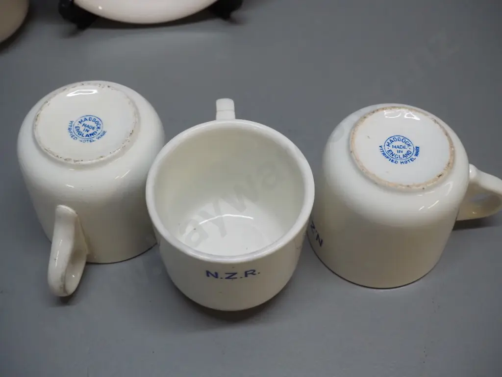 Crown Lynn NZR cup & saucer in good condition & 3 English NZR mugs marked Maddock, each with fault or repair Image 1++