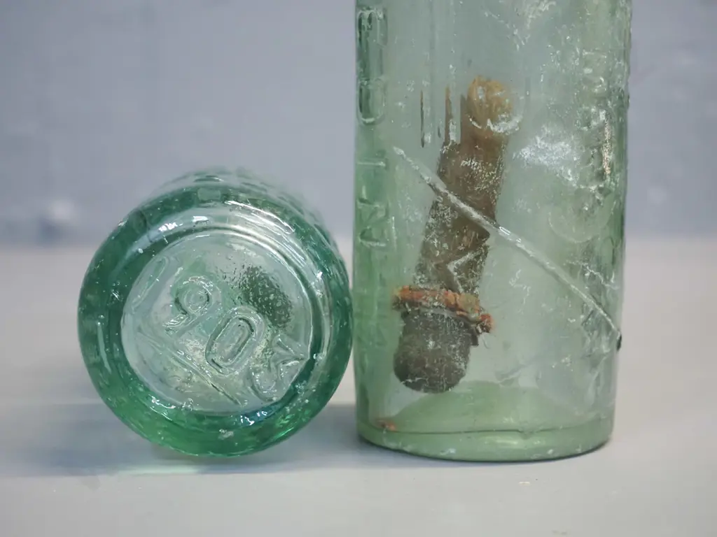 vintage Thomson & Co. Dunedin Crystal Springs minereal water marble bottle with green marble and a Thomson & Co Dunedin Image 1++