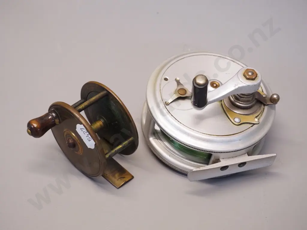 2 fly fishing reels - larger aluminium one marked JT Crouch Sons Melbourne D90, smaller brass marked Prickman Exeter Image 1++
