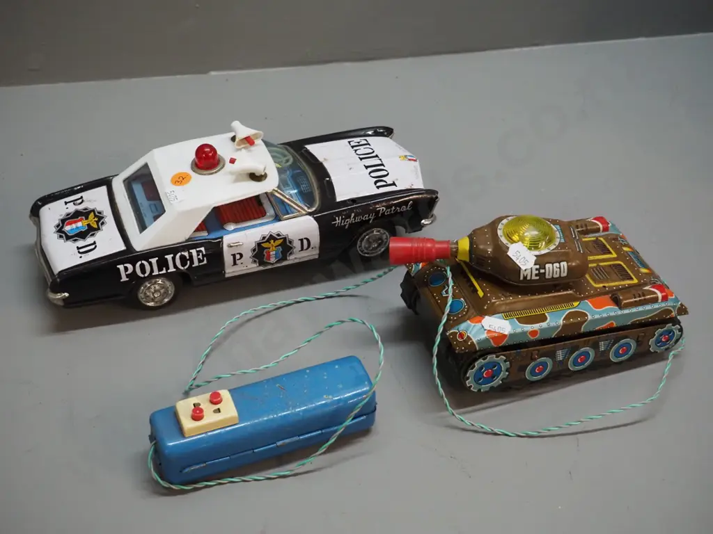 2 battery operated tin toy vehicles - Banda Japan police car H90 L280 & tank with wired remote control - both untested, Image 1++