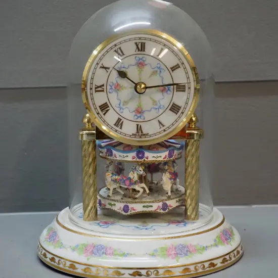 floral motif porcelain and plastic anniversary clock with glass dome, quartz movement H180 D140