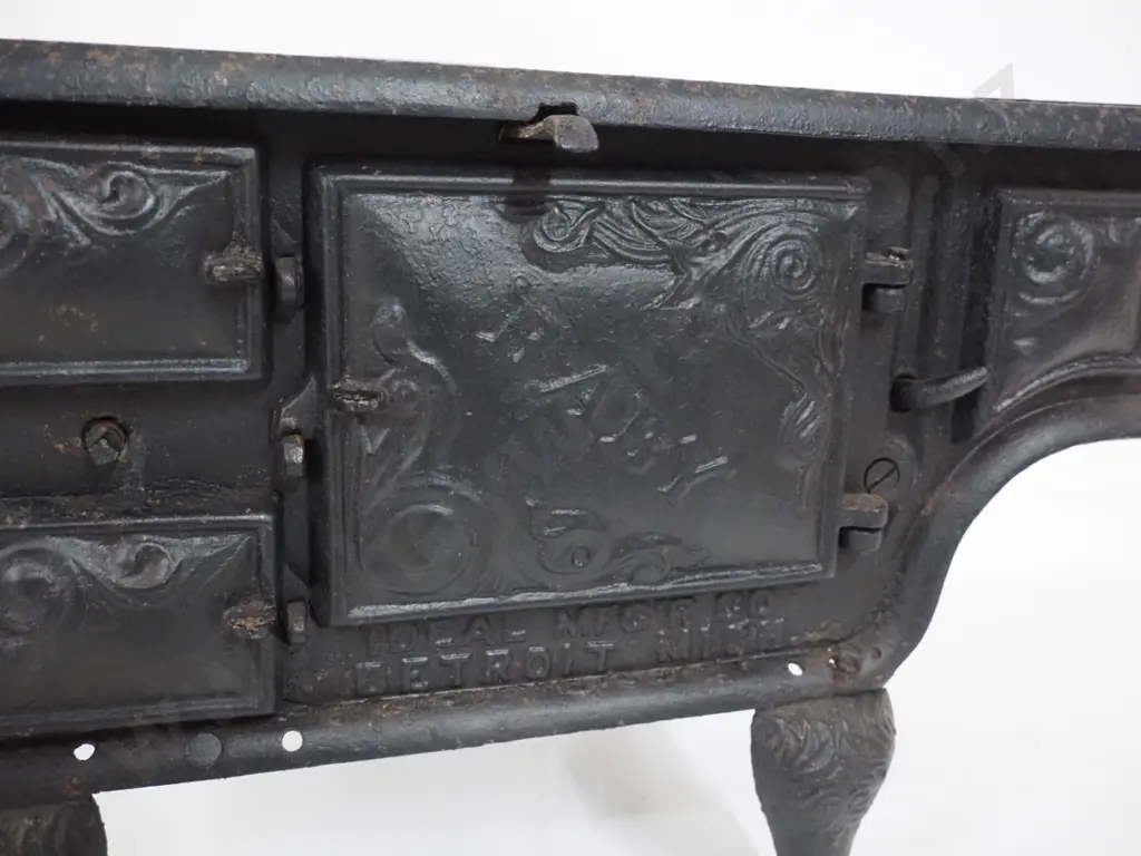 miniature cast iron stove marked "Baby" and Ideal Manufacturing Co. Detroit - missing end plate or door and hot plates Image 1++