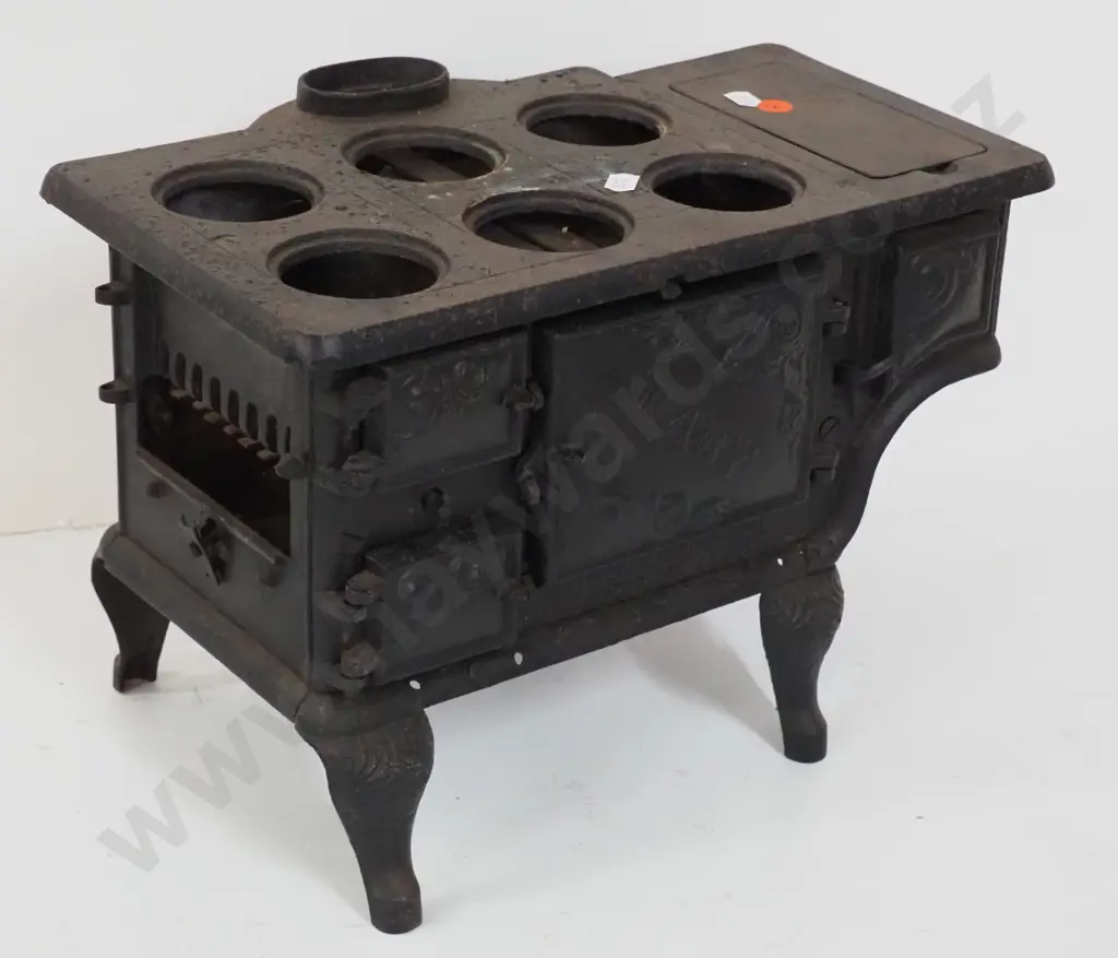 miniature cast iron stove marked "Baby" and Ideal Manufacturing Co. Detroit - missing end plate or door and hot plates Image 1++