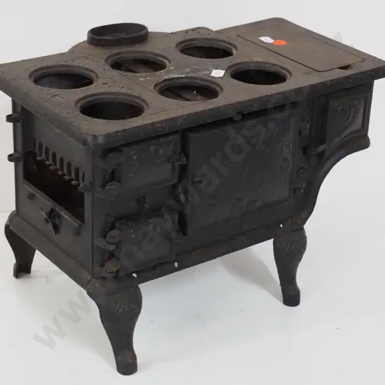 miniature cast iron stove marked "Baby" and Ideal Manufacturing Co. Detroit - missing end plate or door and hot plates