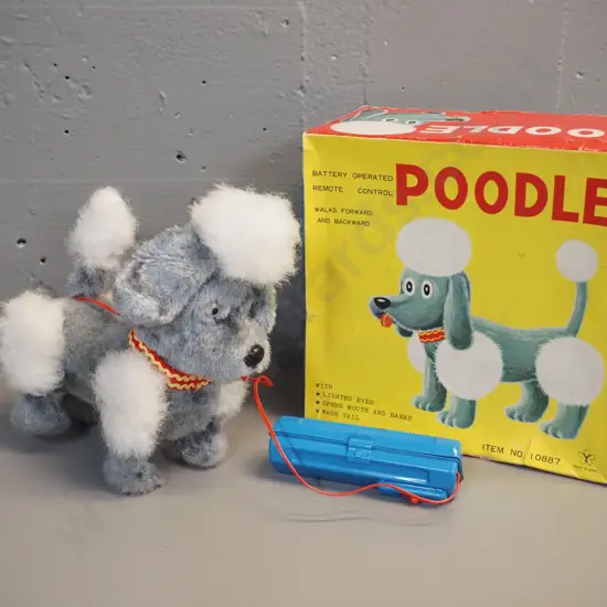 battery operated tin toy poodle and wired remote control, untested but battery compartment is clean H-220 L-230
