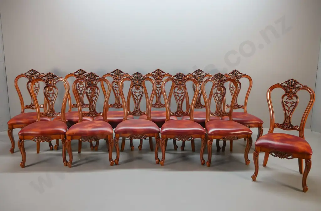 large traditional style heavily carved mahogany double pedestal extending dining table and 12 leather upholstered Image 1++