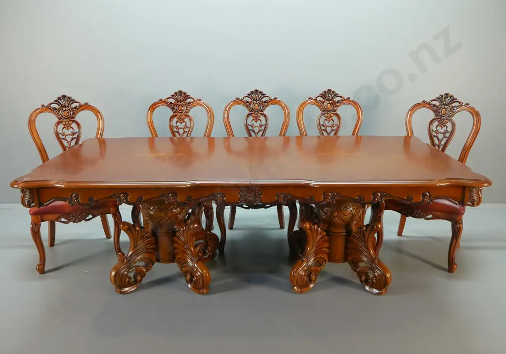large traditional style heavily carved mahogany double pedestal extending dining table and 12 leather upholstered Image 1++