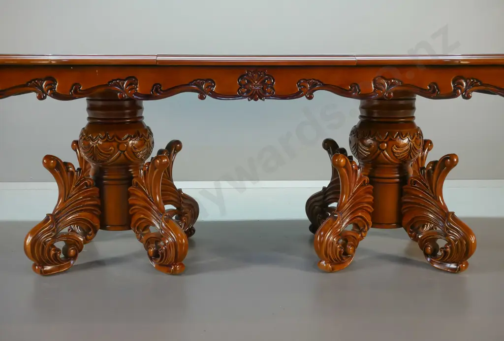 large traditional style heavily carved mahogany double pedestal extending dining table and 12 leather upholstered Image 1++