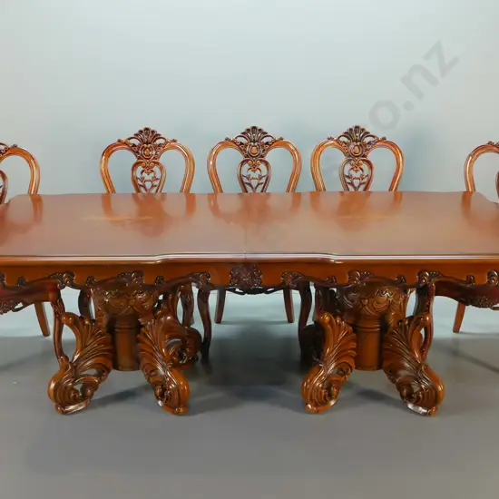 large traditional style heavily carved mahogany double pedestal extending dining table and 12 leather upholstered