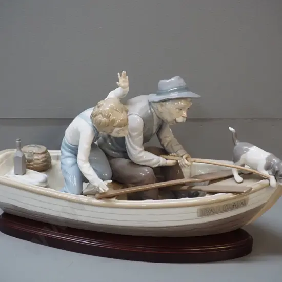 Lladro large figure of boat with man and boy fishing, on wooden stand, damage to fishing rod & boys hand H-220 L-400
