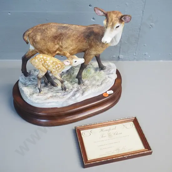 Hereford NZ hand-painted hind and fawn figurine on fitted wooden base, H230 L260, with certificate. H-290 L-300