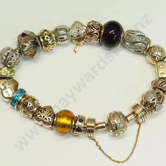 Modern 10ct yellow gold Michael Hill / Emma & Roe charm bracelet with safety chain, length 20cm - valuation in office