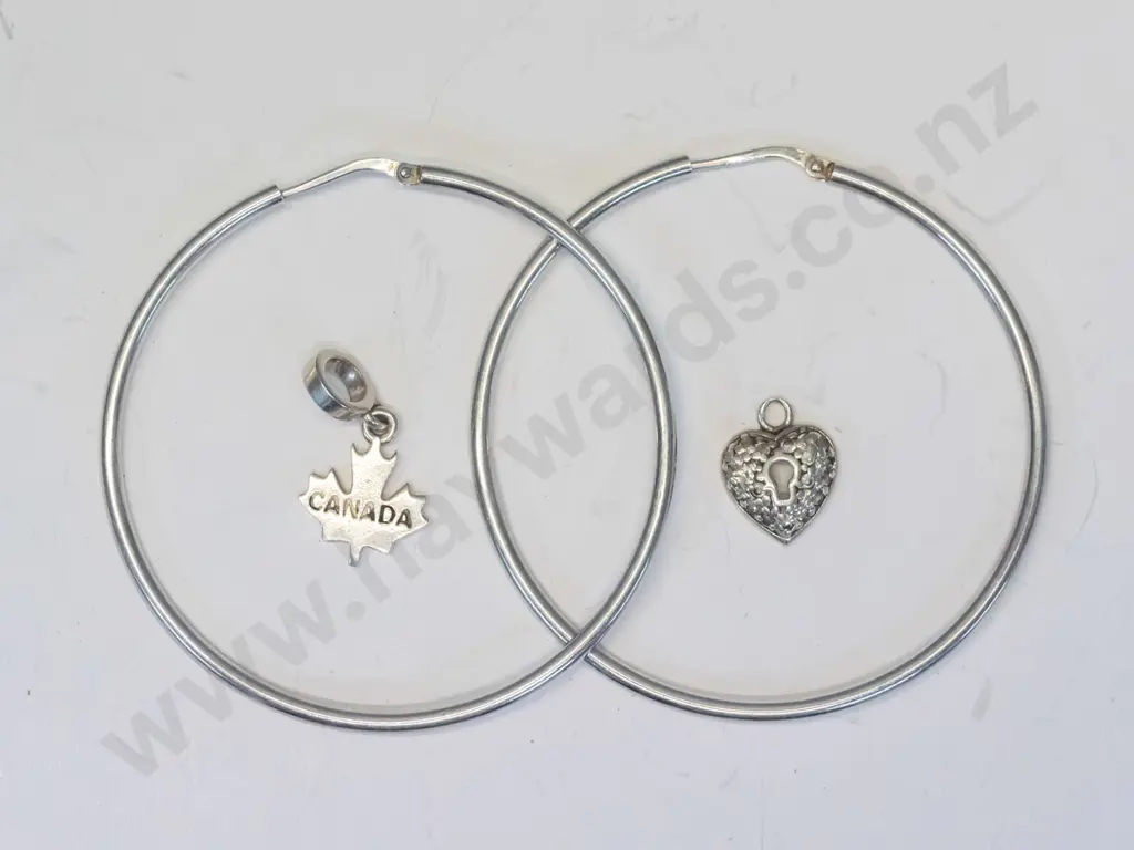 pair of silver hoop earrings, silver heart necklace [no chain] & silver maple leaf no chain] all stamped 925 Image 1++