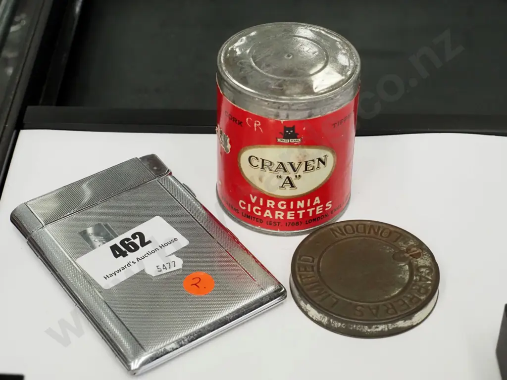 sealed tin of Craven A  Virginia cigarettes and a plated cigarette case with integrated lighter Image 1++