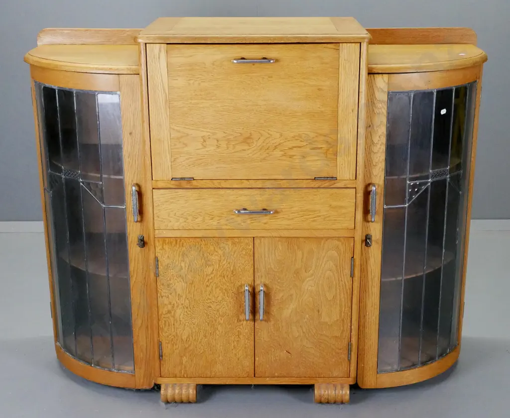 deco oak display / cocktail cabinet with 2 leadlight doors, fold out mirrored serving flap, drawer - some desilvering Image 1++