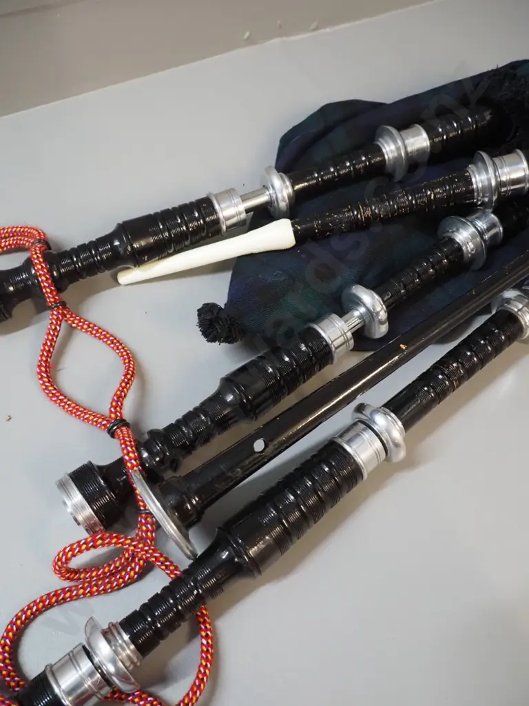 set of bagpipes in black carry bag Image 1++