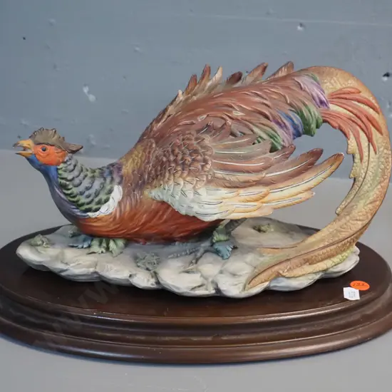Capodimonte pheasant figure resting on wooden base H-200 L-340