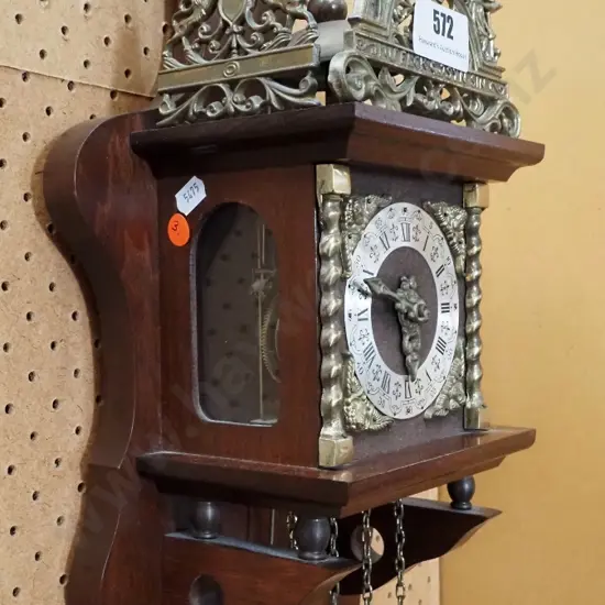 ornate brass, timber and glass cased striking wall clock with Atlas figure, ormolu decoration, heavy solid brass