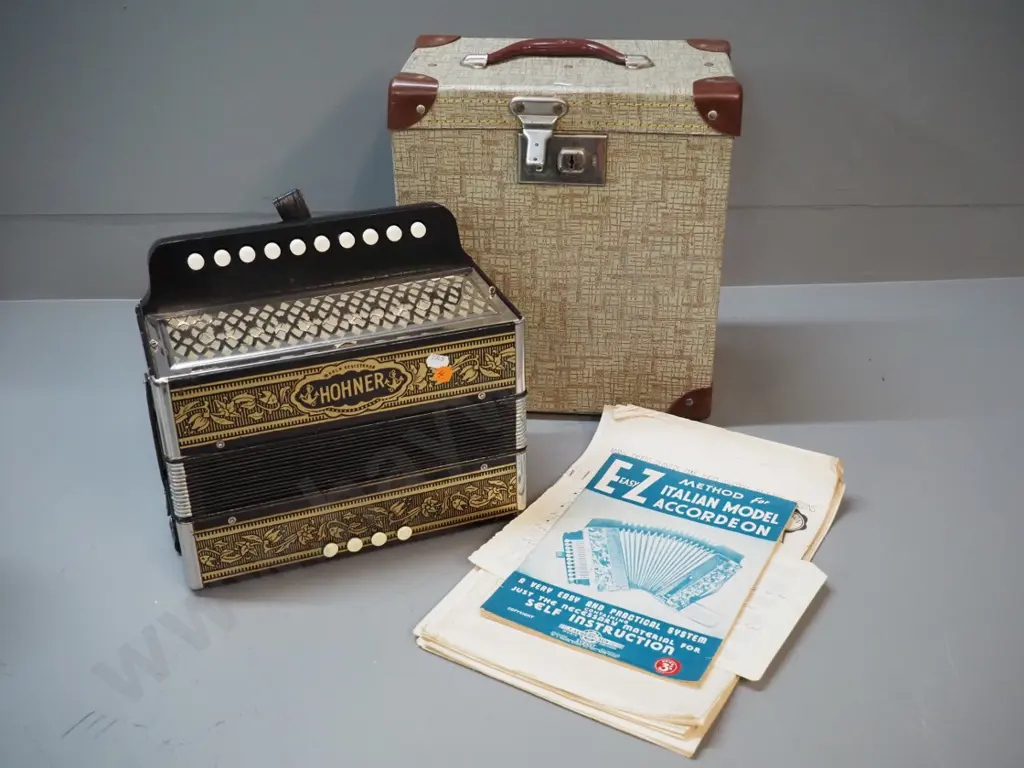 vintage Hohner button accordion, hard case and assorted instructional sheet music - accordion in very good condition Image 1++