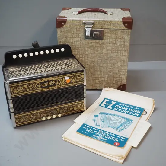 vintage Hohner button accordion, hard case and assorted instructional sheet music - accordion in very good condition