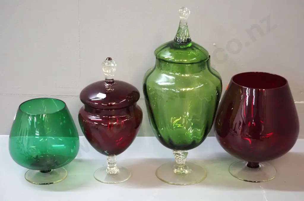 4 pieces of coloured glass - 2 large brandy balloon shaped vases and 2 lidded stemmed jars, tallest is green jar H340 Image 1++