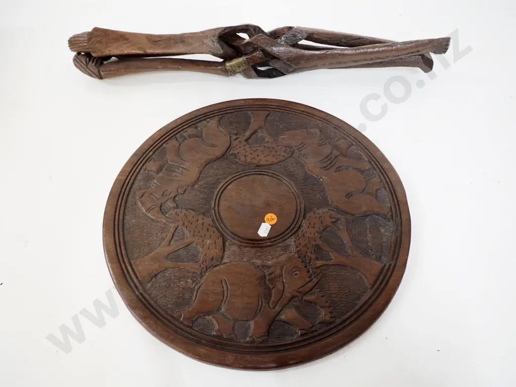 carved hardwood ethnic tribal style collapsible table with decoration on both sides of top H-360 Top D-360 Image 1++