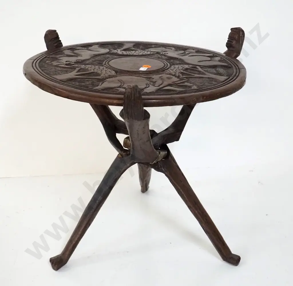 carved hardwood ethnic tribal style collapsible table with decoration on both sides of top H-360 Top D-360 Image 1++