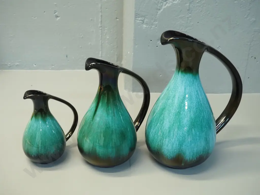 3 Blue Mountain teal glaze ewer jugs in graduated sizes, larger H-320 W-250 Image 1++
