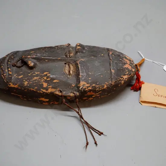 carved & painted wooden, one shell eye missing - New Guinea Sepik River canoe shield mask according to tag. H-340 W-170