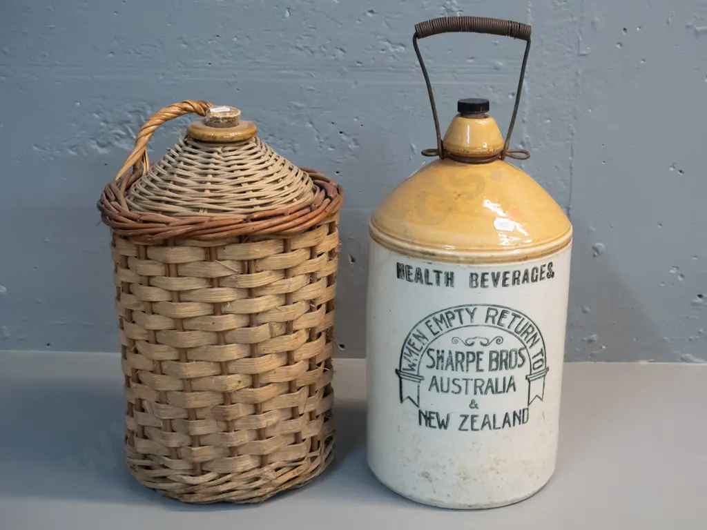2 stoneware narrow-moth crocks - Sharpe Bros. Australia & New Zealand H-360, with wire handle, other covered in cane Image 1++