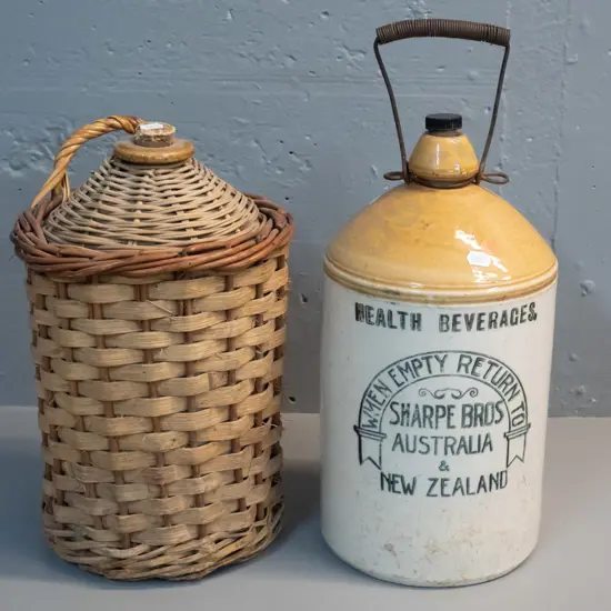 2 stoneware narrow-moth crocks - Sharpe Bros. Australia & New Zealand H-360, with wire handle, other covered in cane