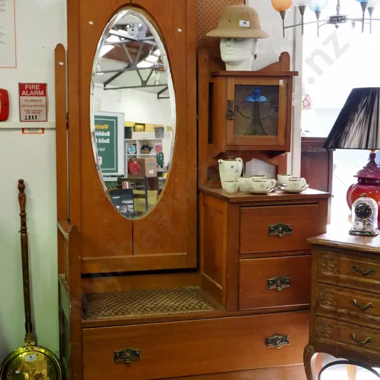 deco oak hall stand with seat, 3 drawers, upper cupboard w/leadlight door and oval bevelled mirror - has some borer,