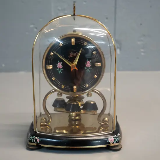 Schatz German anniversary clock - brass and painted metal with plastic and brass dome H-180 W-225
