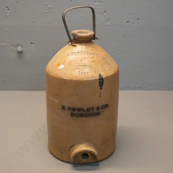 narrow-mouth crock with metal handle, marked R Powley & Co Dunedin 2669, chip to rim. No tap. H460 D220