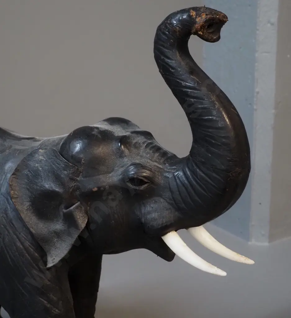 large leather covered elephant figure with plastic tusks, plastic or glass eyes - some wear to leather finish H470 L550 Image 1++