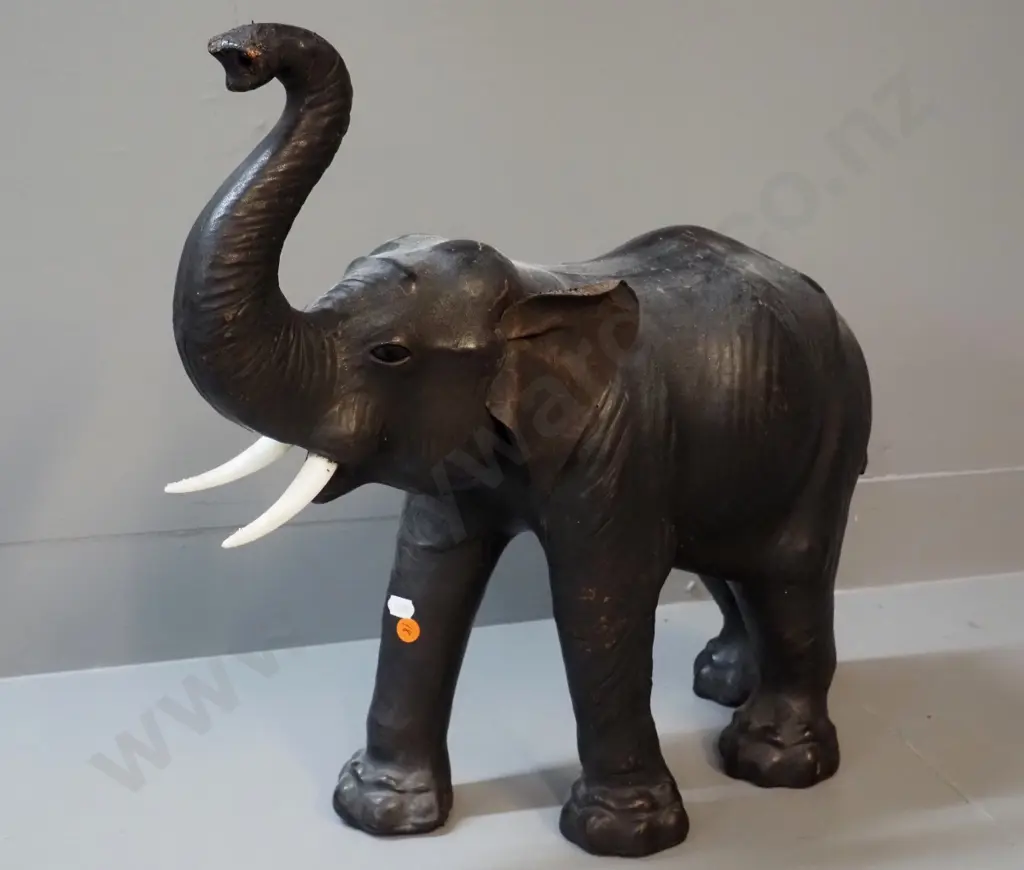 large leather covered elephant figure with plastic tusks, plastic or glass eyes - some wear to leather finish H470 L550 Image 1++