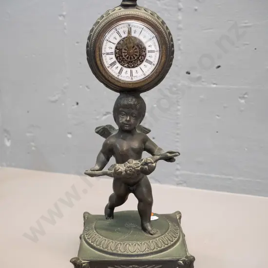 cast metal figural mantel clock with built-in winder - movement marked Germany H-300