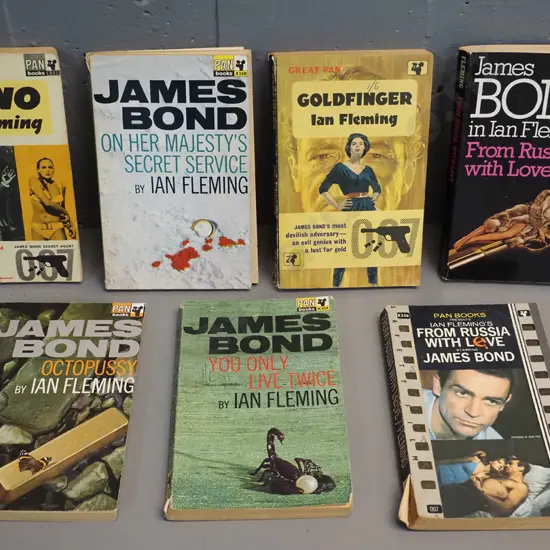 7 retro paperback editions of James Bond novels - earliest is 1964, general wear & minor damage