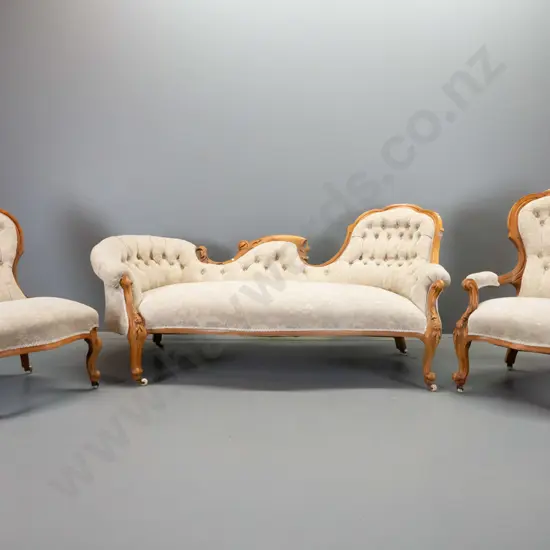 Victorian carved walnut parlour suite, all on porcelain casters, deep-button backs, covered in chenille velvet. Some