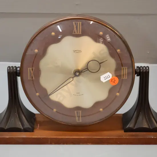 deco Smiths mantel clock in tilting bakelite, timber, copper and polished metal case, movement replaced with quartz