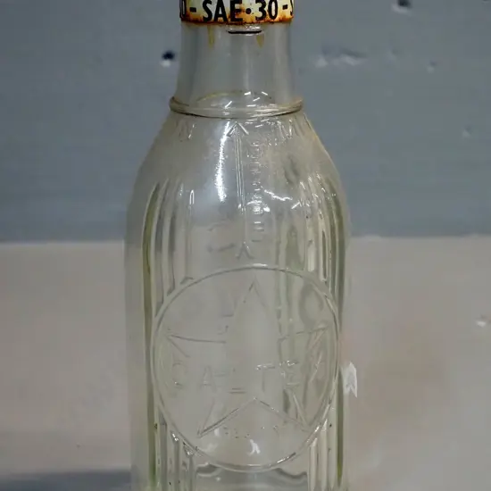 Caltex motor oil pint bottle with metal cap and SAE30 grade band H-230
