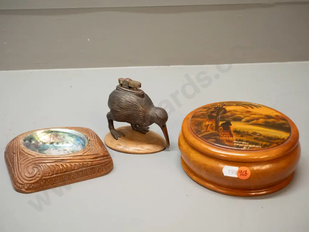 3 New Zealand souvenir items - kiwi lighter and wooden base, pauau ashtray and a Wanganui River round lidded Image 1++