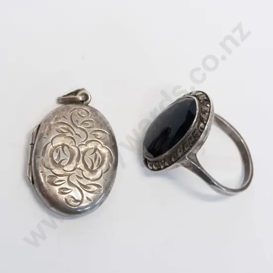 silver ring [stamped sterling] & silver locket no chain stamped anchor, lion & ?