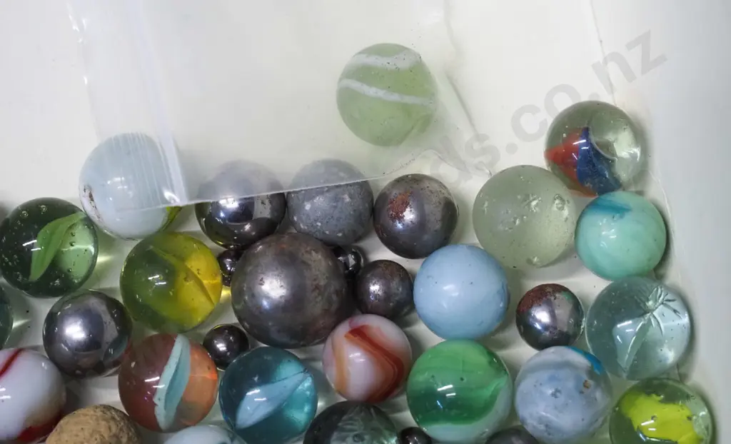 assorted vintage glass and stone marbles, including one uranium glass, some metal bearings, etc. Image 1++