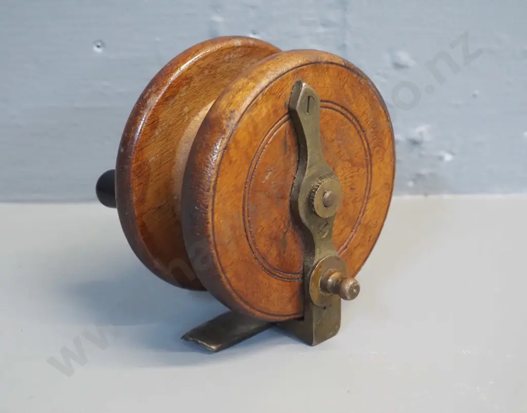 vintage brass and timber fishing reel with timber knobs, marked Allcock & Co Redditch - diameter 90 Image 1++